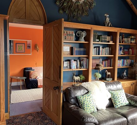 The lounge leading through to the spare room with versatile leather sofa bed